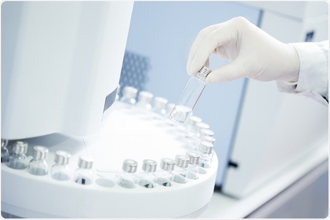 Technician loading sample vials in autosampler rack. Image Credit: Stokkete / Shutterstock