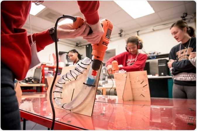 GRADE camp students visit Dr. Aaron Becker and the UH Robotic Swarm Control Lab. The blue mass represents the blood clot the participants are trying to break up.