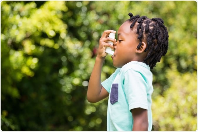 Boy using an asthma inhaler. Image Credit: Wavebreakmedia / Shutterstock