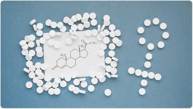 Female hormone progesterone. Molecular chemical formula on blue background. Image Credit: Linda Kar