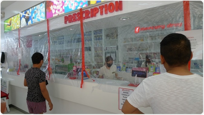 MAKATI CITY, PHILIPPINES – APRIL 05 2020: Pharmacies with improvised protective shields to address the COVID19 pandemic. Image Credit: trysterfries / Shutterstock