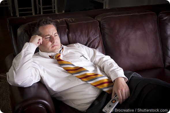 Lazy Male watching Television at home